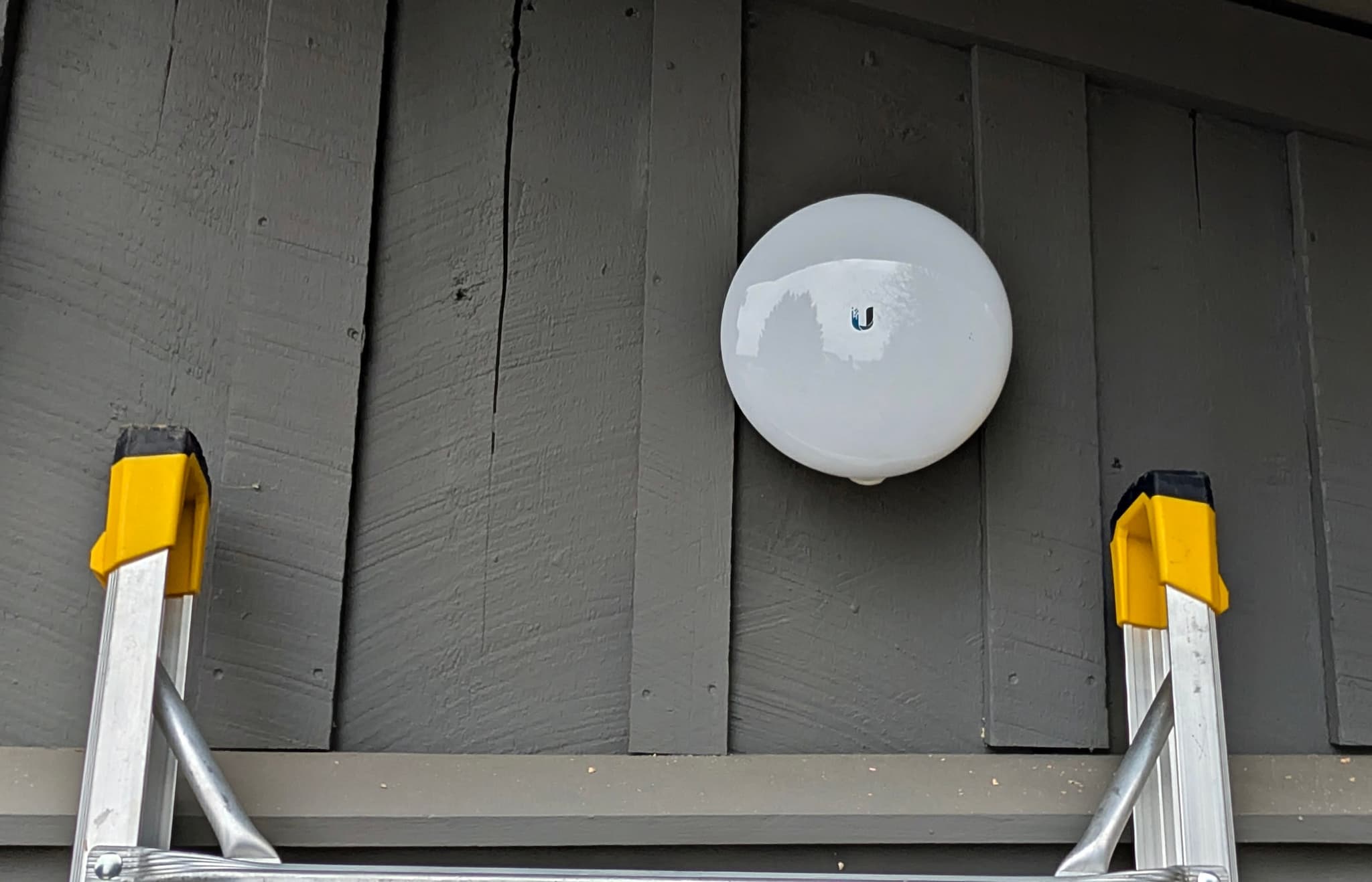 Building-to-building bridge radio mounted high on a barn gable in Western Loudoun, Virginia