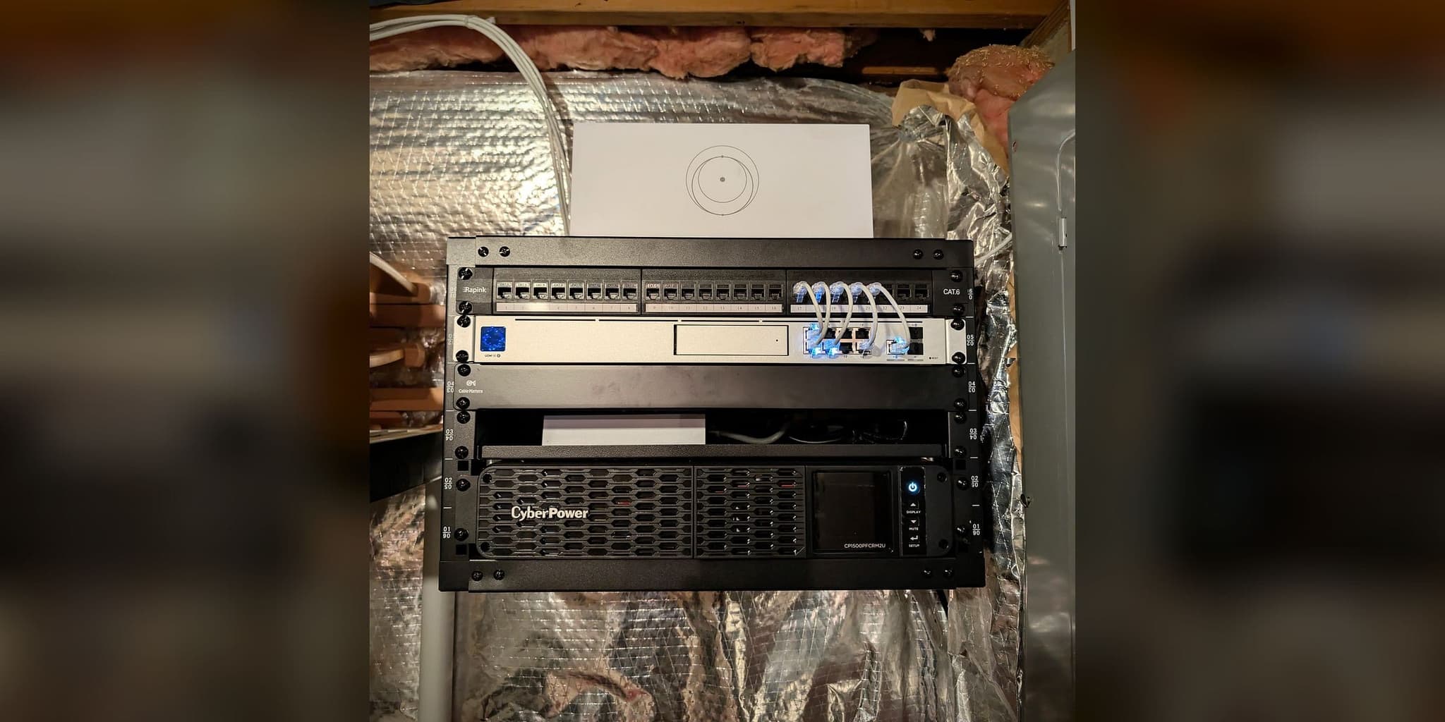 Open-frame network core in Great Falls, VA — UniFi Dream Machine SE, PoE switch, Starlink router, and CyberPower UPS