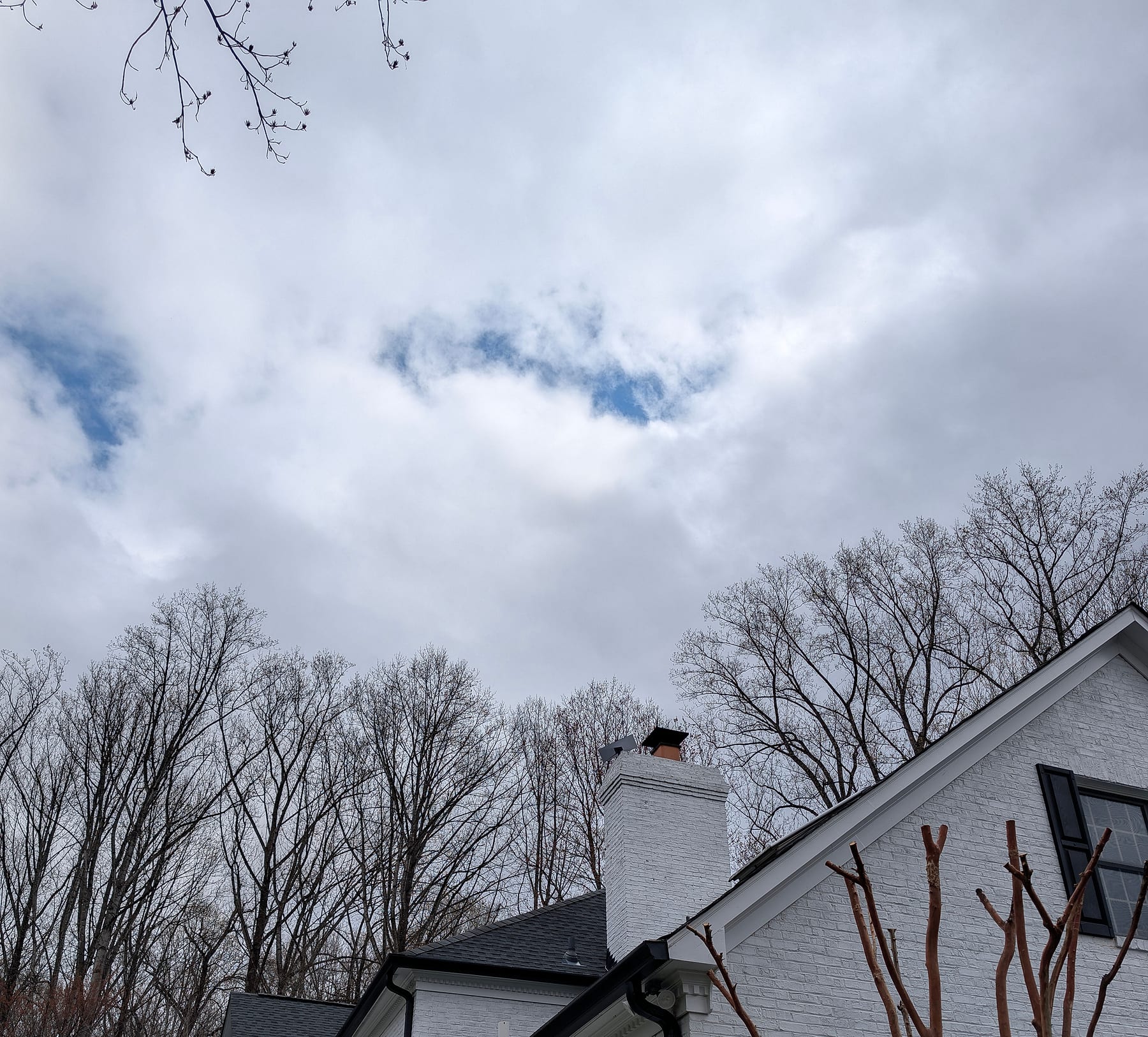 Residence exterior with the Starlink Gen 3 dish mounted on the roof, Great Falls, Virginia