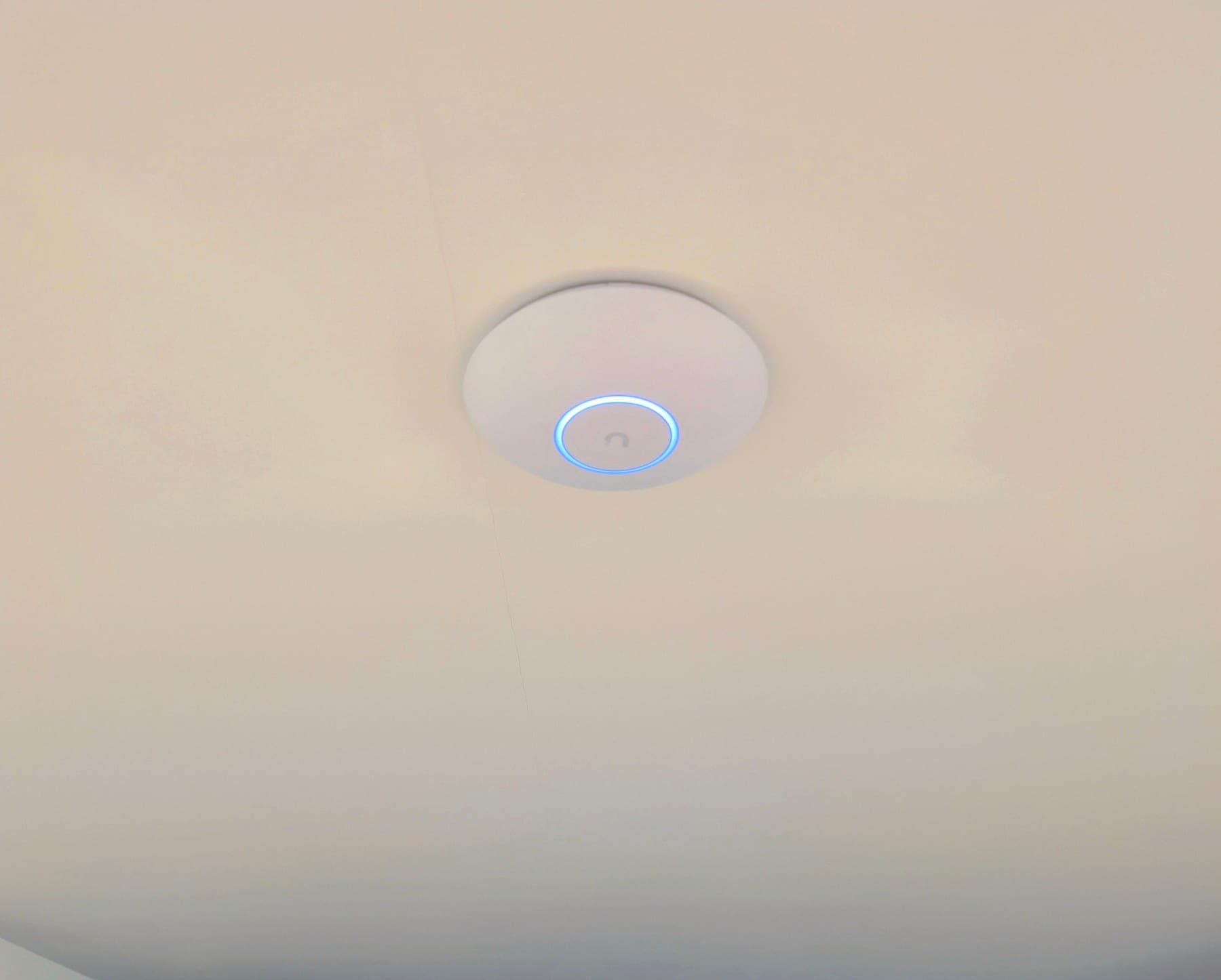 WiFi 7 access point ceiling-mounted in the lower-level office and fitness room