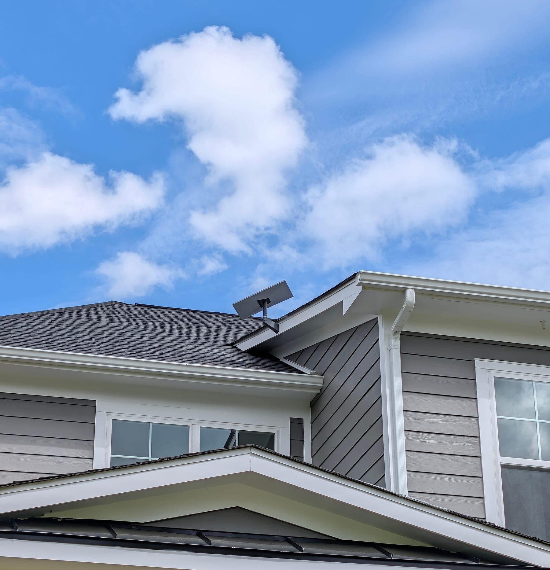 Front elevation with the Starlink Gen 3 dish mounted at the roof peak