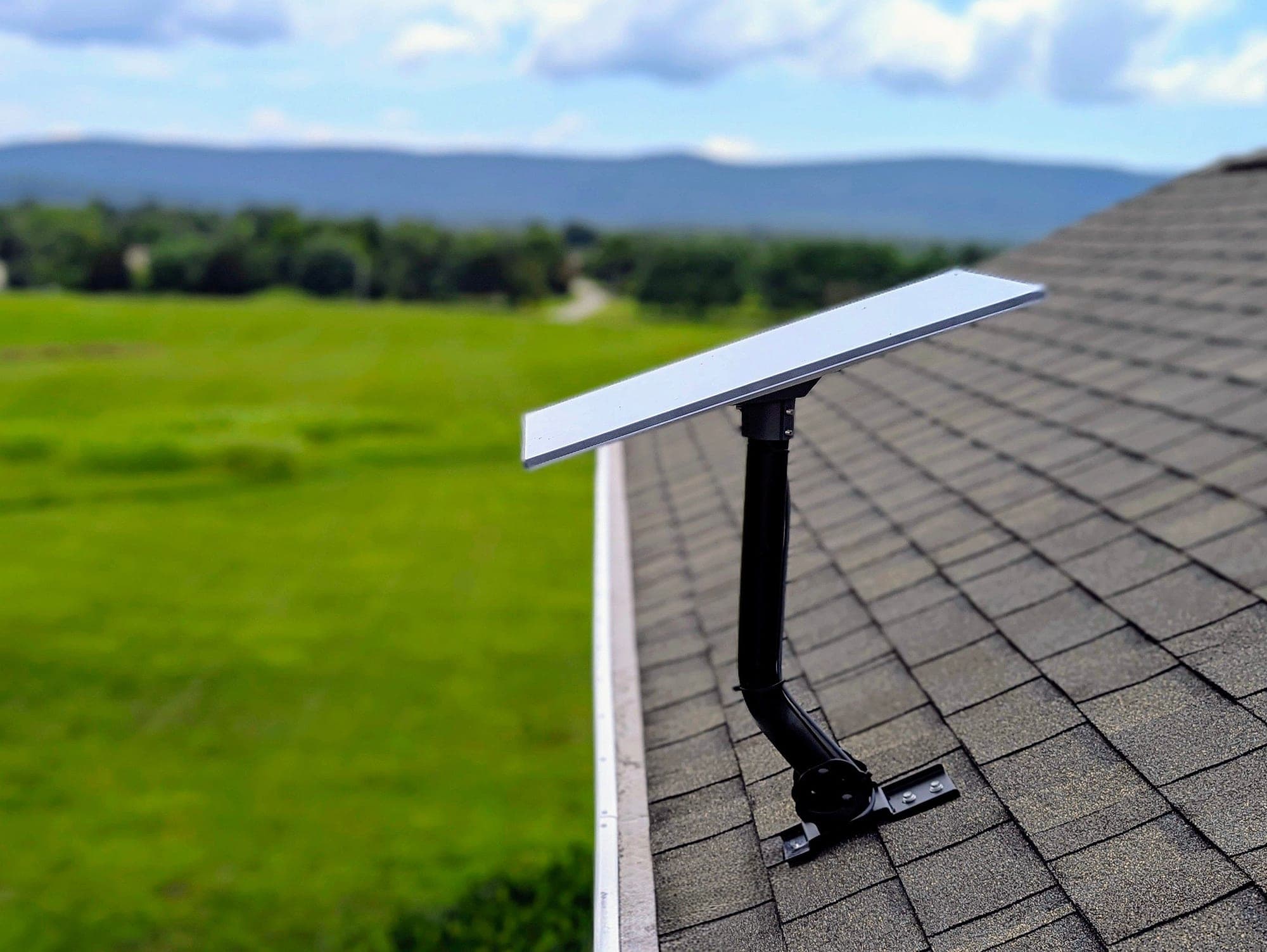 Roof mount detail — dish and mast at the roof edge