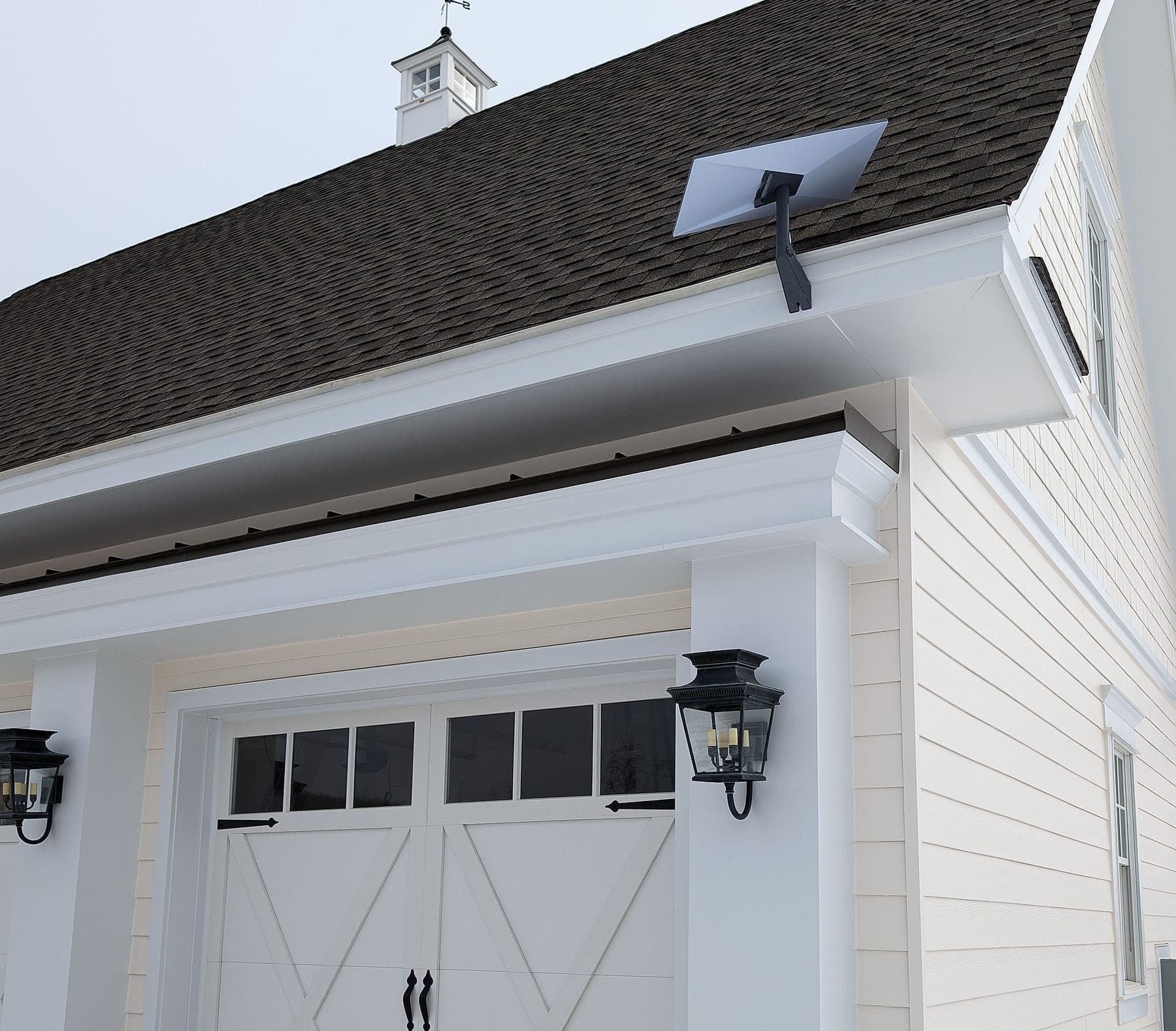 Starlink dish roof-mounted on a detached garage (representative photo)